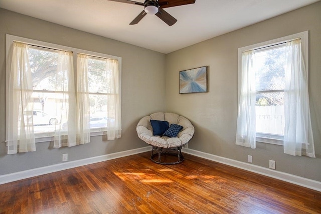 unfurnished room featuring ceiling fan and dark wood-type flooring