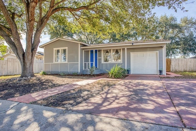 ranch-style home featuring a garage