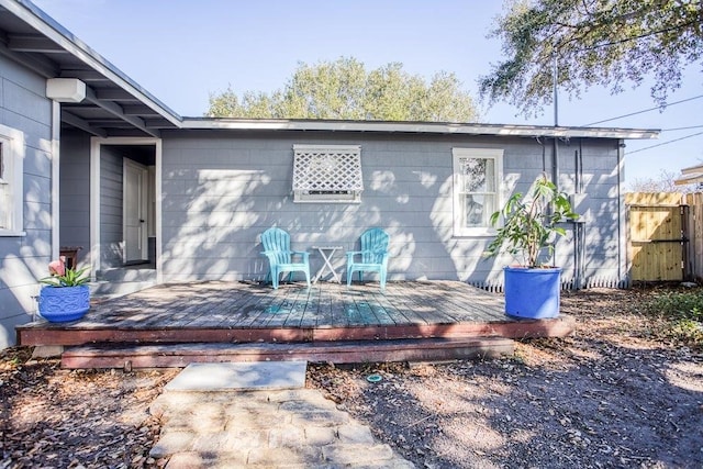 back of house featuring a deck