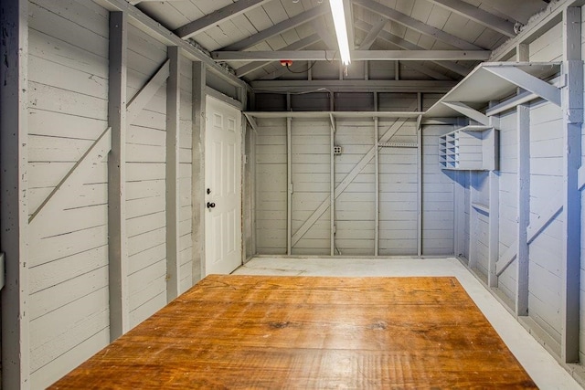 interior space with wood walls and wood ceiling