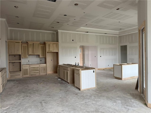 kitchen featuring crown molding, light brown cabinetry, and a towering ceiling