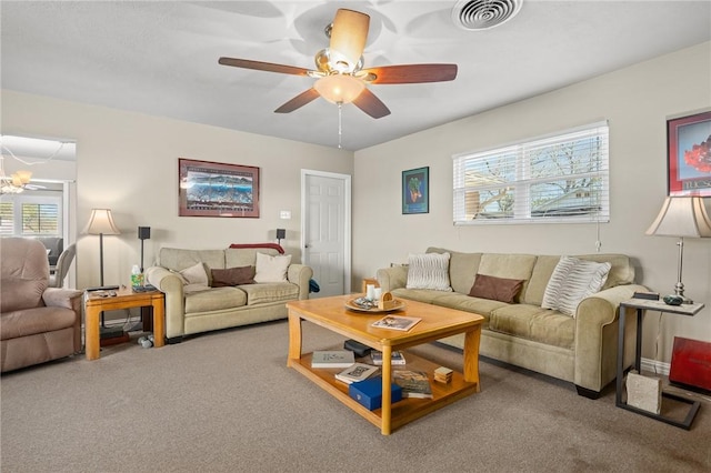 314 Inglewood, Ingleside, TX 78362 - living room with visible vents, carpet flooring, and a ceiling fan