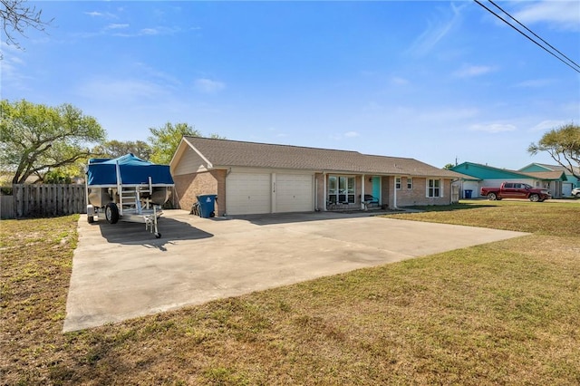 314 Inglewood, Ingleside, TX 78362 - ranch-style home with a front yard, fence, driveway, a garage, and brick siding