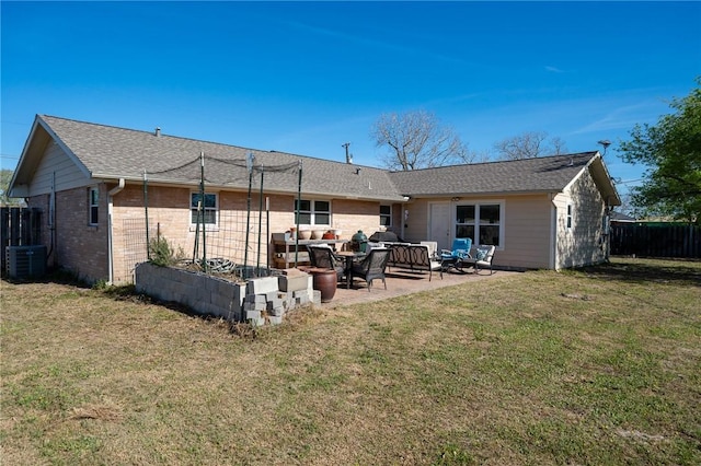 314 Inglewood, Ingleside, TX 78362 - back of house featuring a patio, central AC unit, fence, an outdoor living space, and a yard