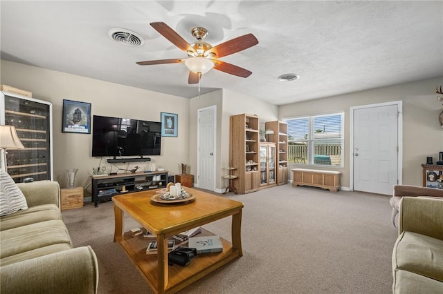 314 Inglewood, Ingleside, TX 78362 - living room featuring a ceiling fan, visible vents, carpet floors, and baseboards