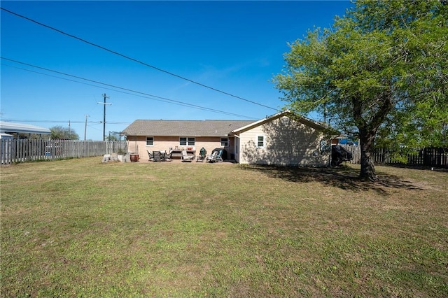 314 Inglewood, Ingleside, TX 78362 - rear view of house featuring a lawn and a fenced backyard