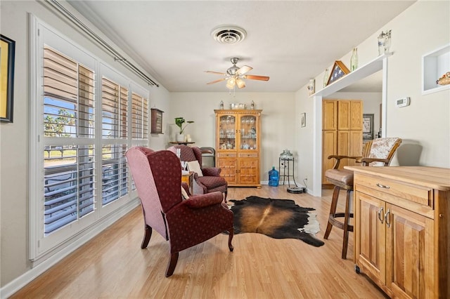 314 Inglewood, Ingleside, TX 78362 - sitting room with visible vents, baseboards, a ceiling fan, and light wood finished floors