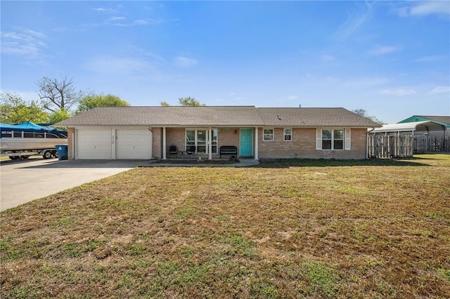 314 Inglewood, Ingleside, TX 78362 - ranch-style house with a garage, brick siding, concrete driveway, and a front lawn