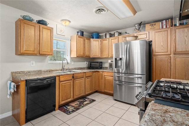 314 Inglewood, Ingleside, TX 78362 - kitchen featuring light tile patterned floors, visible vents, black appliances, and a sink