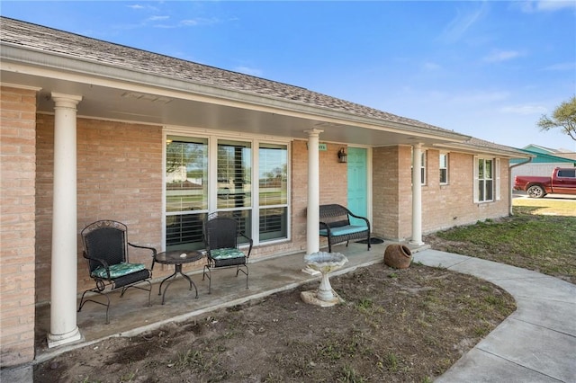 314 Inglewood, Ingleside, TX 78362 - doorway to property featuring brick siding and covered porch