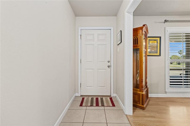314 Inglewood, Ingleside, TX 78362 - doorway with light tile patterned floors and baseboards