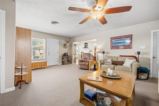 314 Inglewood, Ingleside, TX 78362 - carpeted living room featuring baseboards, visible vents, and ceiling fan