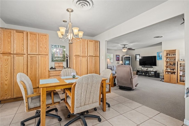 314 Inglewood, Ingleside, TX 78362 - dining area with light tile patterned floors, ceiling fan with notable chandelier, visible vents, and light carpet