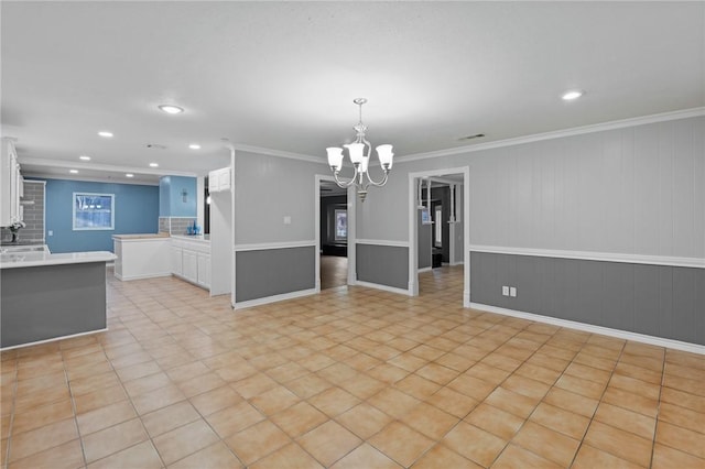 interior space featuring light tile patterned floors, a notable chandelier, recessed lighting, and crown molding