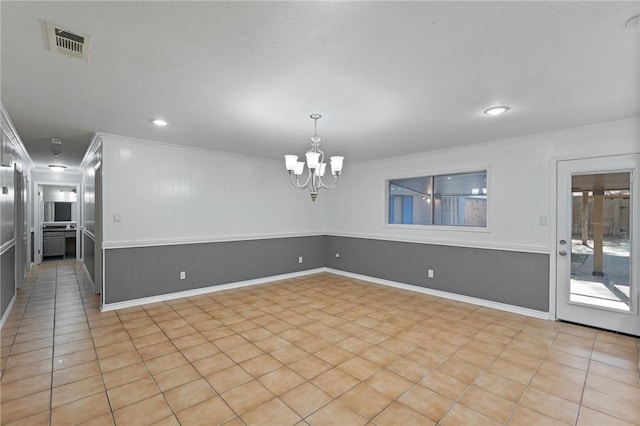 spare room with visible vents, a notable chandelier, ornamental molding, recessed lighting, and light tile patterned floors