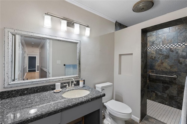 full bath featuring vanity, toilet, a walk in shower, and ornamental molding