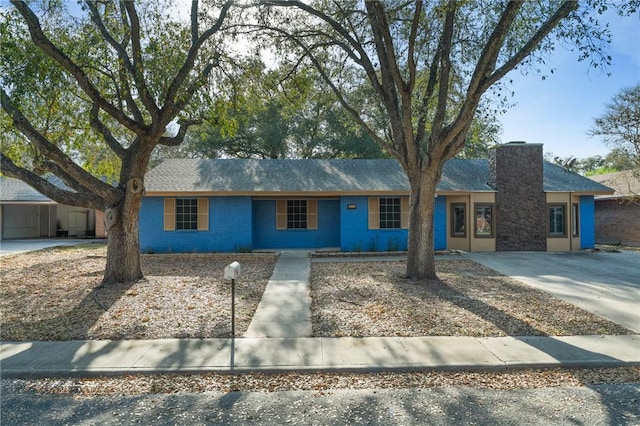 ranch-style house with a chimney