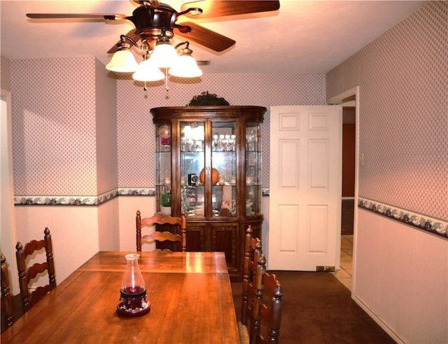 tiled dining room featuring ceiling fan