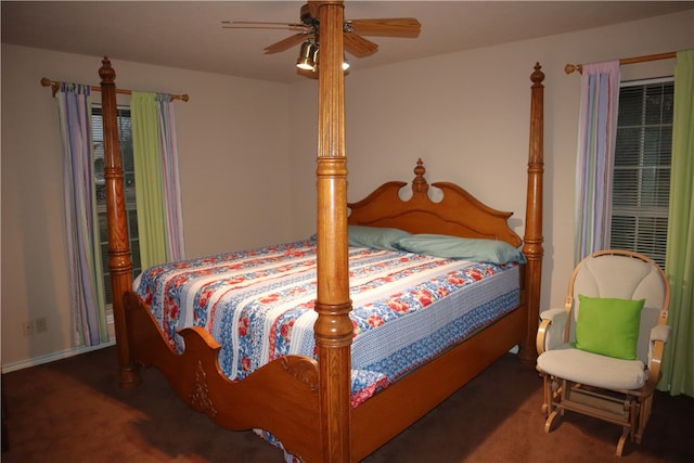 bedroom with ceiling fan and dark carpet