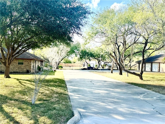 surrounding community featuring a yard