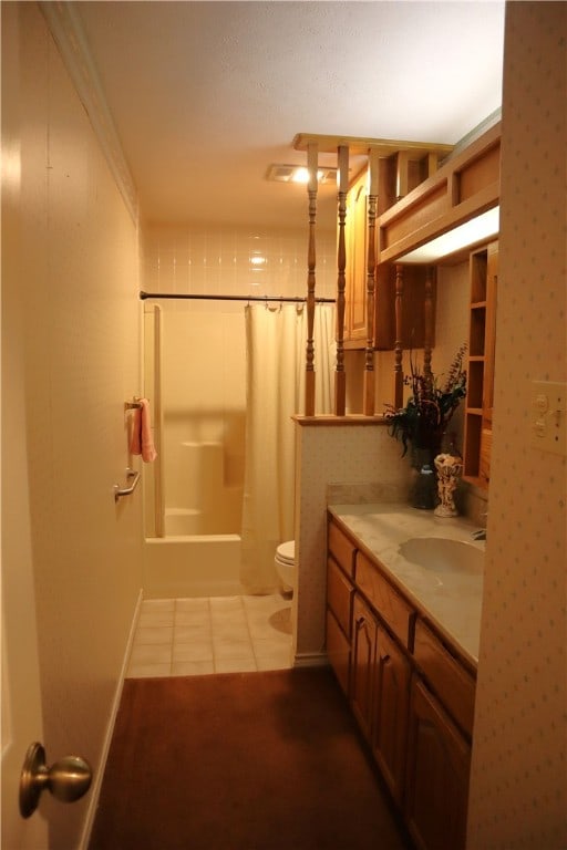 full bathroom featuring tile patterned flooring, shower / bath combination with curtain, toilet, and vanity