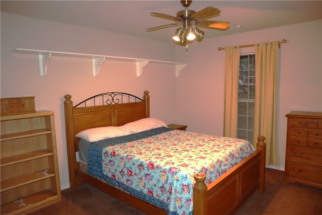 bedroom with dark colored carpet and ceiling fan