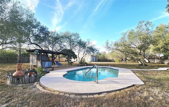 view of pool with a shed