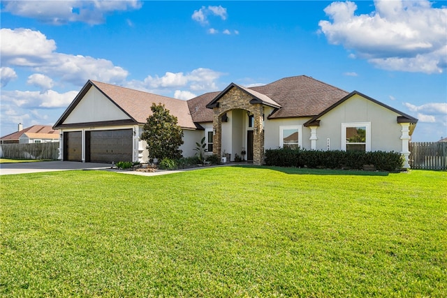 view of front of home with a front lawn and a garage