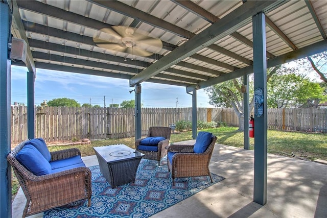 14613 Powell Dr, Corpus Christi, TX 78410 - fenced backyard featuring outdoor lounge area, a patio, and ceiling fan