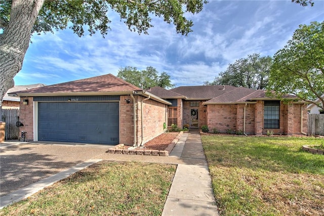 14613 Powell Dr, Corpus Christi, TX 78410 - ranch-style house featuring a garage, driveway, brick siding, and a shingled roof