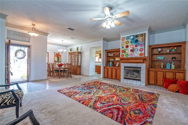 14613 Powell Dr, Corpus Christi, TX 78410 - carpeted living room with crown molding, a textured ceiling, a ceiling fan, tile patterned floors, and a fireplace