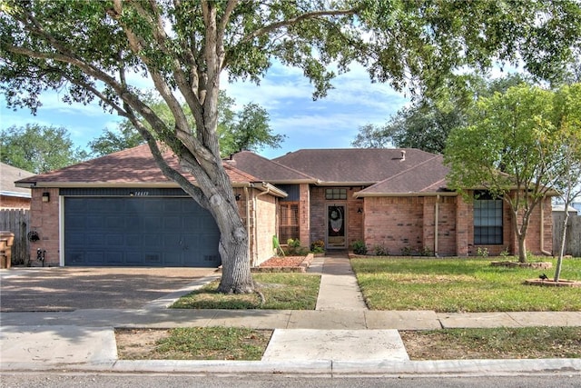 14613 Powell Dr, Corpus Christi, TX 78410 - single story home with driveway, an attached garage, brick siding, and roof with shingles