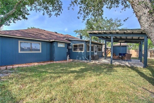 14613 Powell Dr, Corpus Christi, TX 78410 - back of house featuring a patio area and a storage unit