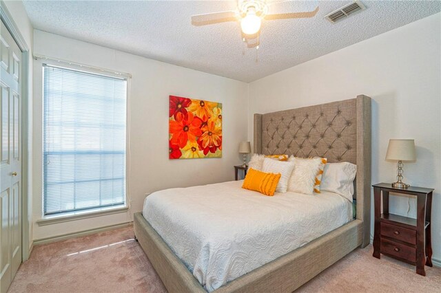 14613 Powell Dr, Corpus Christi, TX 78410 - bedroom with carpet floors, a textured ceiling, and a ceiling fan