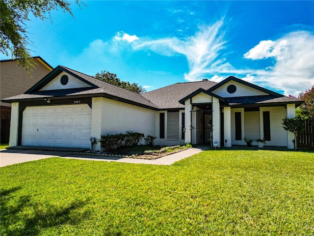 ranch-style house with a garage and a front lawn