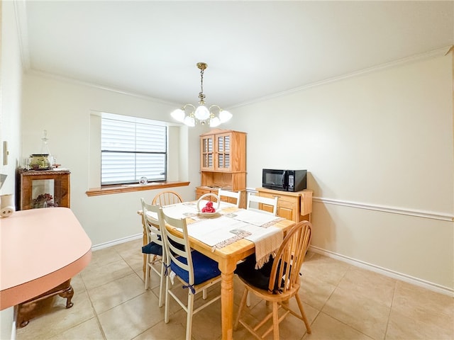 tiled dining room with crown molding and an inviting chandelier