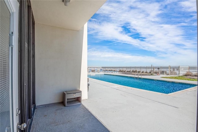 view of pool featuring a patio