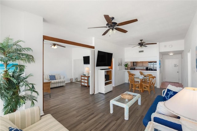 living room featuring dark hardwood / wood-style floors and ceiling fan