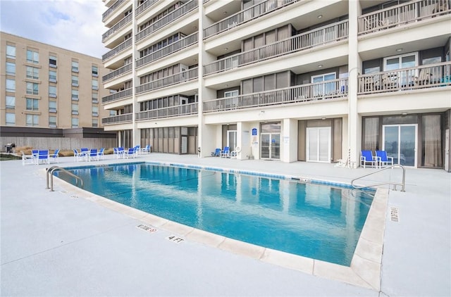 view of swimming pool with a patio