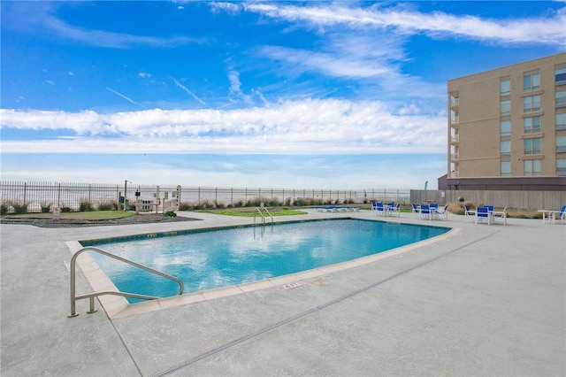 view of swimming pool with a patio area