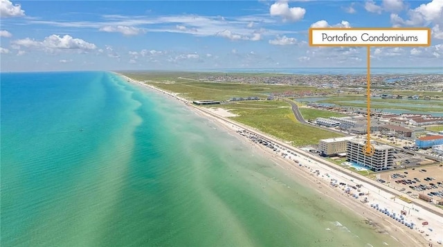 aerial view featuring a view of the beach and a water view