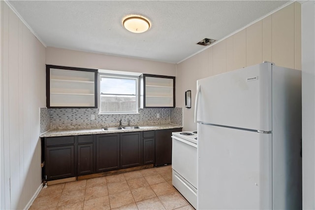 1318 W Cherrystone Dr, Corpus Christi, TX 78412 - kitchen featuring white appliances, light countertops, decorative backsplash, crown molding, and glass insert cabinets