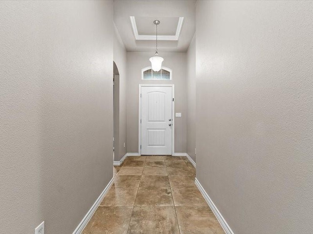 7717 Pruet Dr, Corpus Christi, TX 78414 - doorway to outside with arched walkways and a raised ceiling