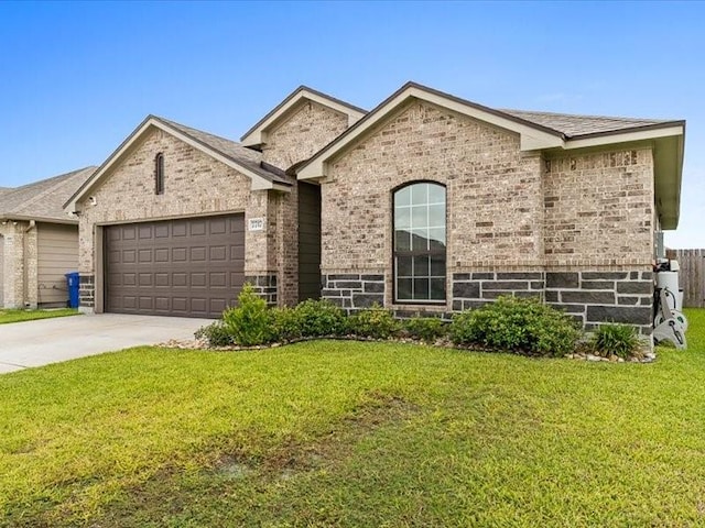 7717 Pruet Dr, Corpus Christi, TX 78414 - view of front of property featuring an attached garage, brick siding, a front yard, and driveway
