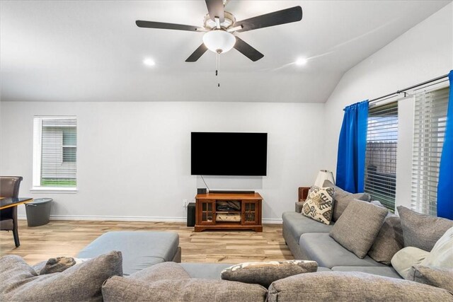 2673 Abbey Rd, Corpus Christi, TX 78415 - living room featuring wood finished floors, plenty of natural light, a ceiling fan, vaulted ceiling, and recessed lighting