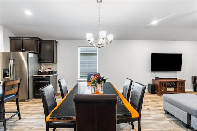2673 Abbey Rd, Corpus Christi, TX 78415 - dining area featuring light wood-style flooring and a chandelier