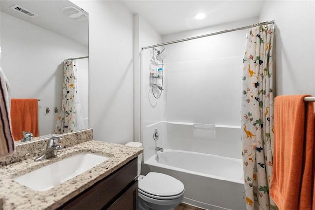 2673 Abbey Rd, Corpus Christi, TX 78415 - full bath with shower / tub combo, toilet, vanity, and recessed lighting