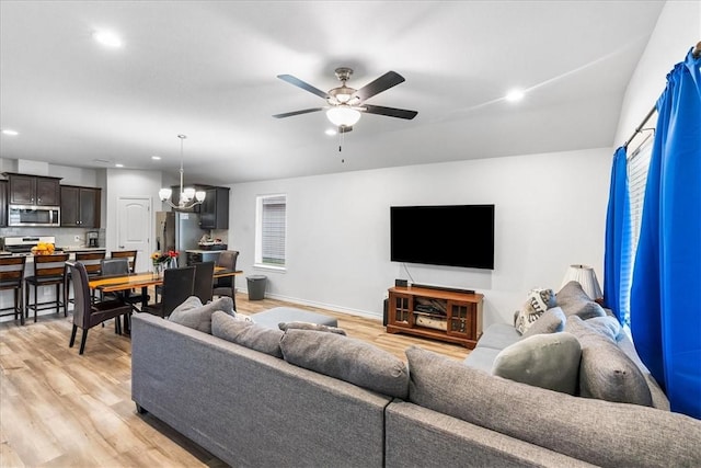 2673 Abbey Rd, Corpus Christi, TX 78415 - living area featuring recessed lighting, light wood finished floors, ceiling fan, baseboards, and a chandelier