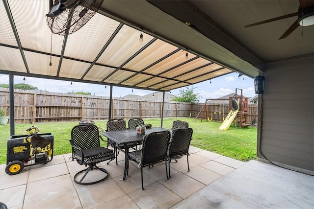 2673 Abbey Rd, Corpus Christi, TX 78415 - view of patio with outdoor dining space, a ceiling fan, and a playground