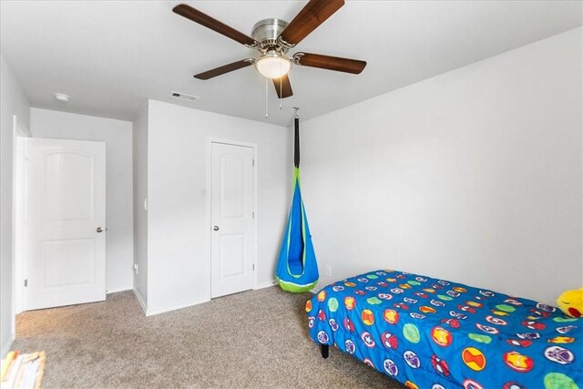 2673 Abbey Rd, Corpus Christi, TX 78415 - unfurnished bedroom featuring carpet floors, a ceiling fan, and baseboards